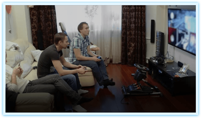 People playing video games at home.