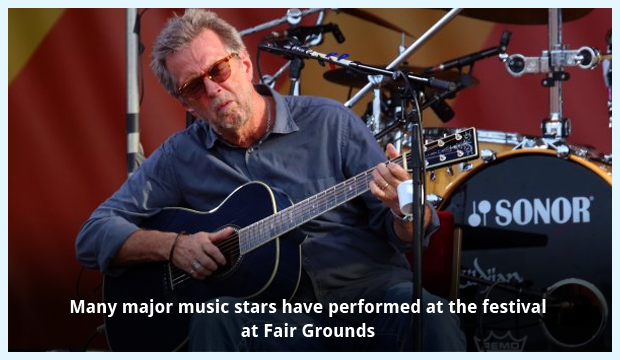 Eric Clapton performing at Fair Grounds Race Course